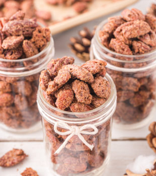 three mason jars filled with candied nuts