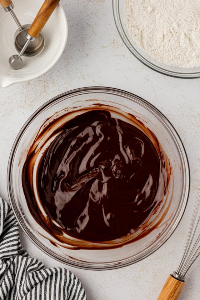 Overhead view of melted butter and chocolate in glass bowl