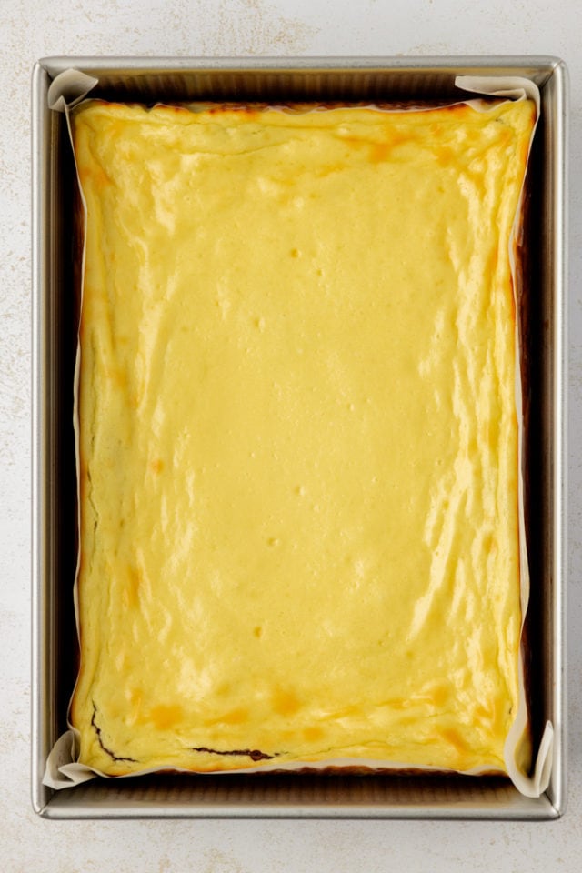 Overhead view of cheesecake brownies in baking pan