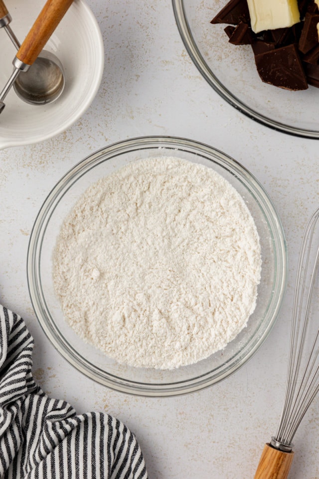 Overhead view of dry ingredients for brownies in mixing bowl