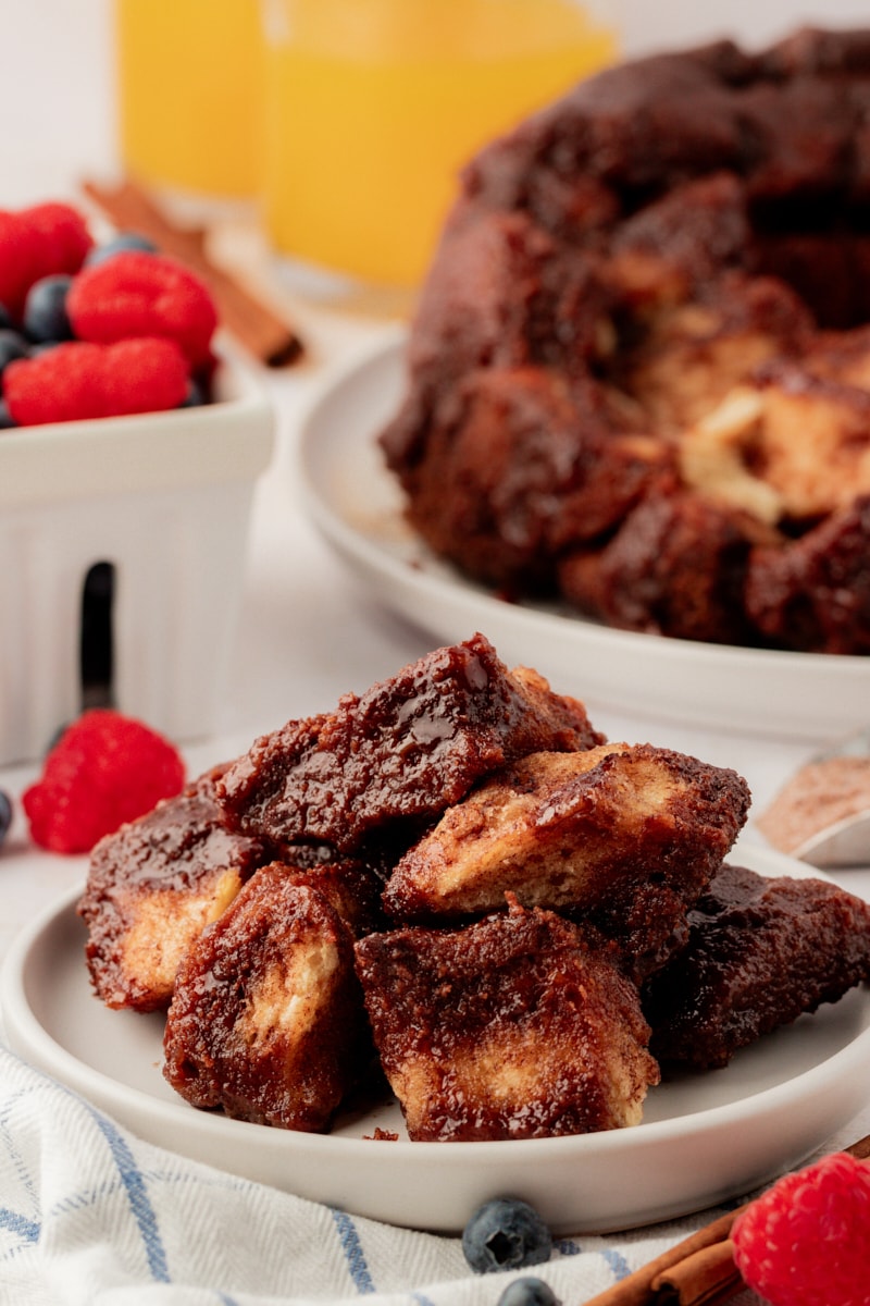Plate of chocolate monkey bread with remaining bread in background