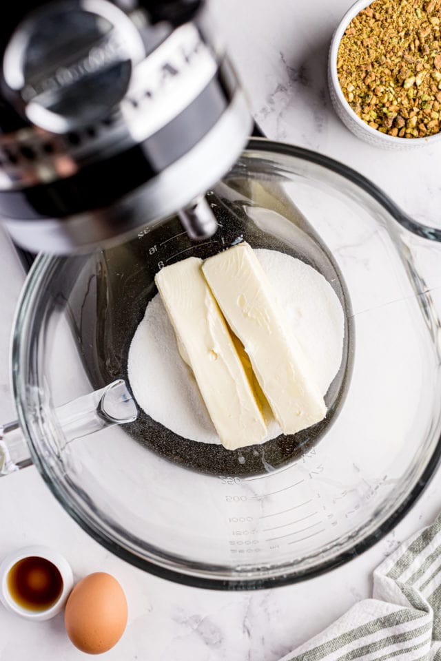 overhead view of sugar and butter in the bowl of a stand mixer