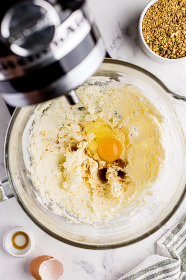 overhead view of egg and vanilla added to creamed butter and sugar