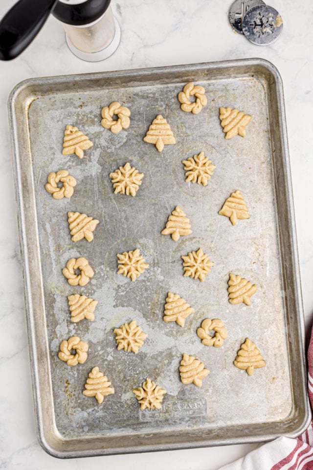 overhead view of spritz cookies on a baking pan