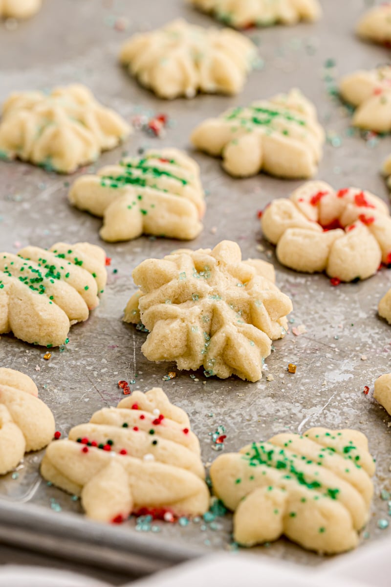 Christmas spritz cookies on a baking sheet