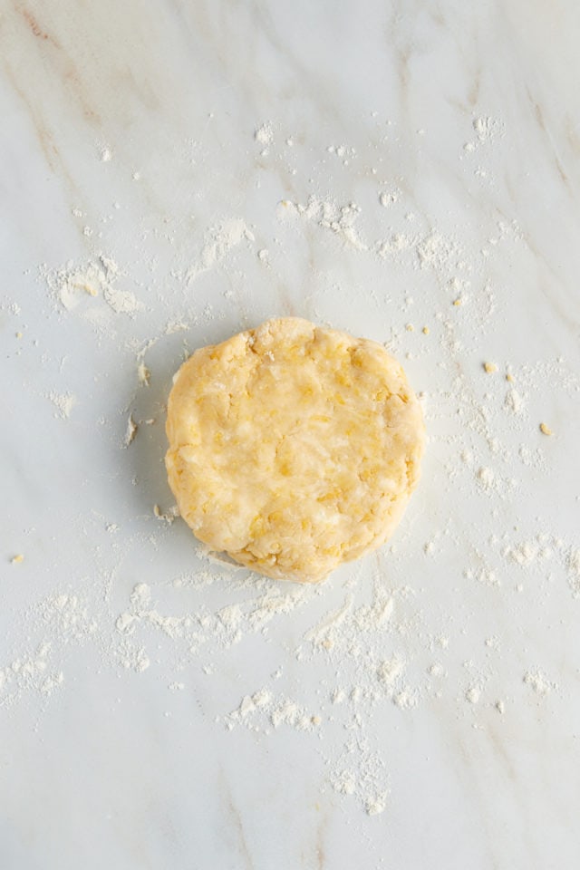 Overhead view of tart dough formed into disc