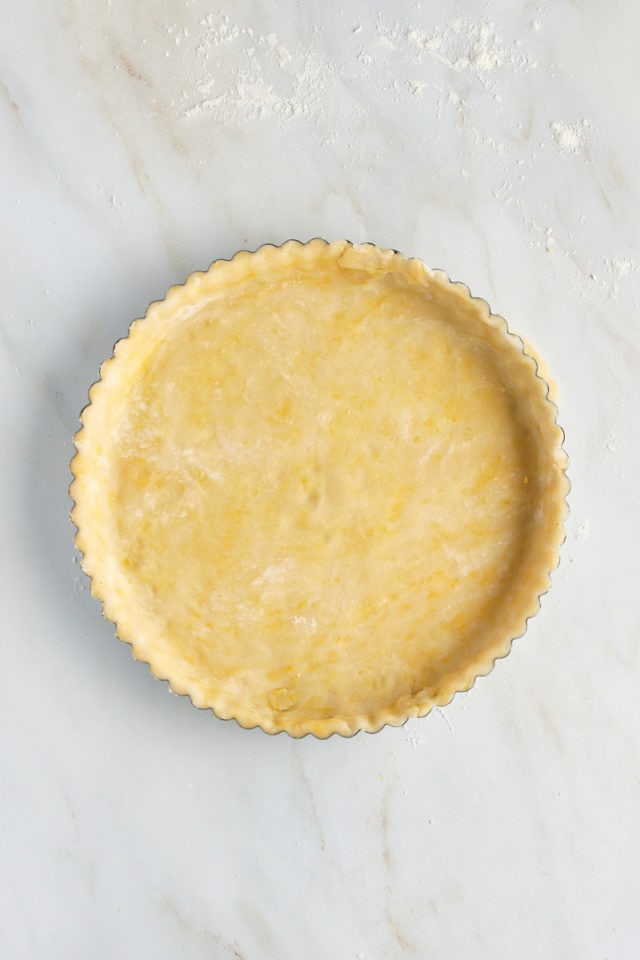 Overhead view of pastry crust in tart pan