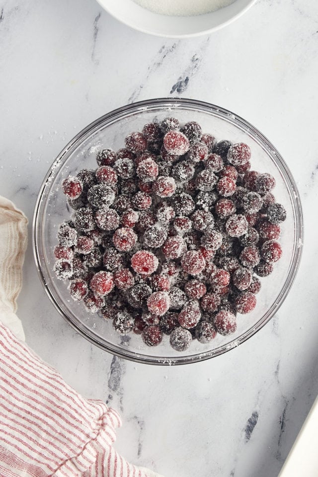 overhead view of syrup-coated cranberries tossed with sugar