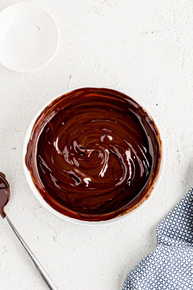 Overhead view of melted chocolate and butter in bowl