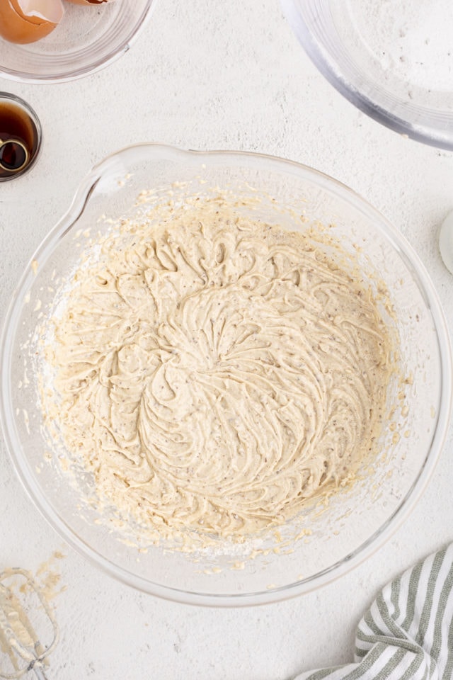 Overhead view of batter for pecan cake in mixing bowl