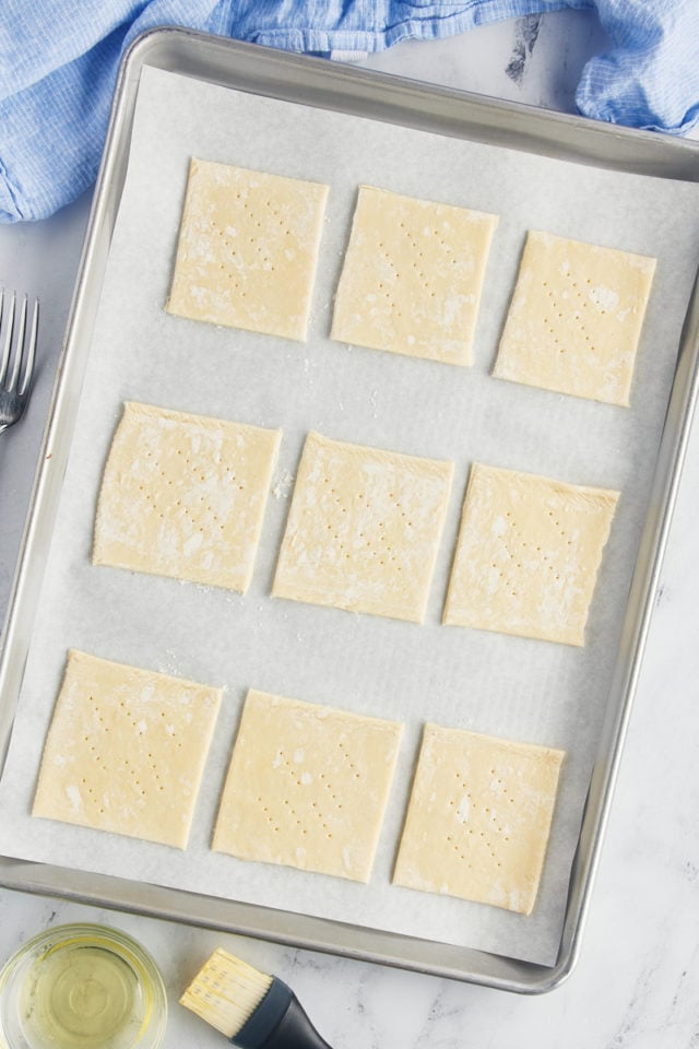 Overhead view of pastry squares on sheet pan