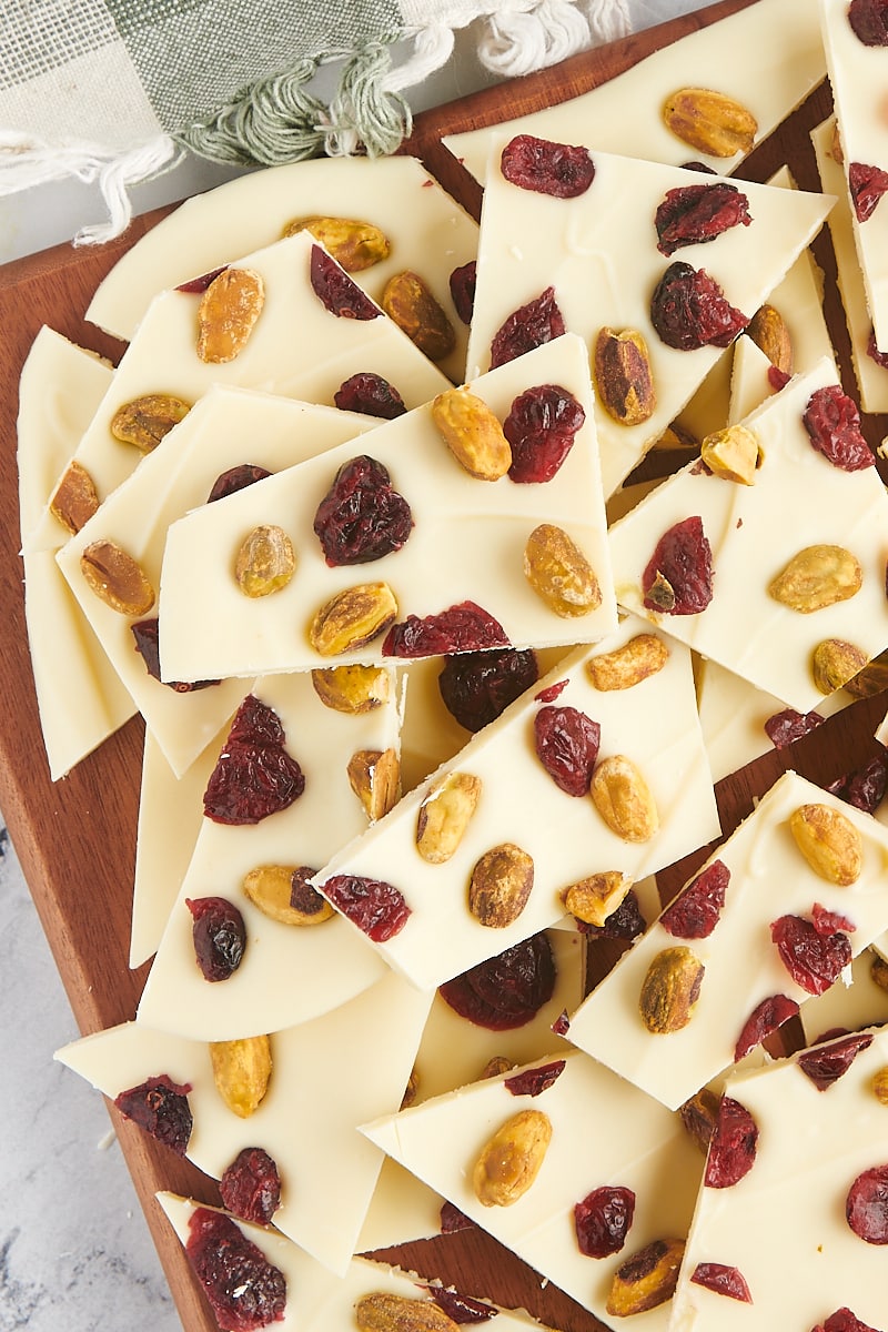 overhead view of cranberry pistachio bark piled on a cutting board