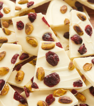 a big pile of cranberry pistachio bark on a cutting board