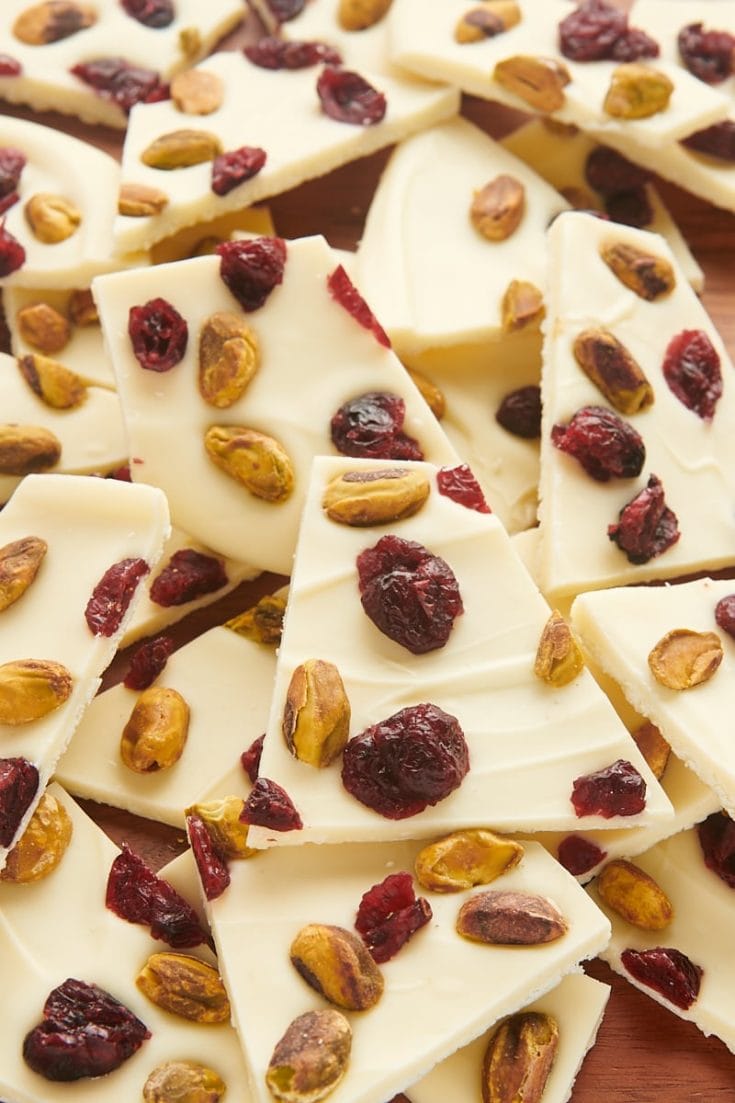 a big pile of cranberry pistachio bark on a cutting board