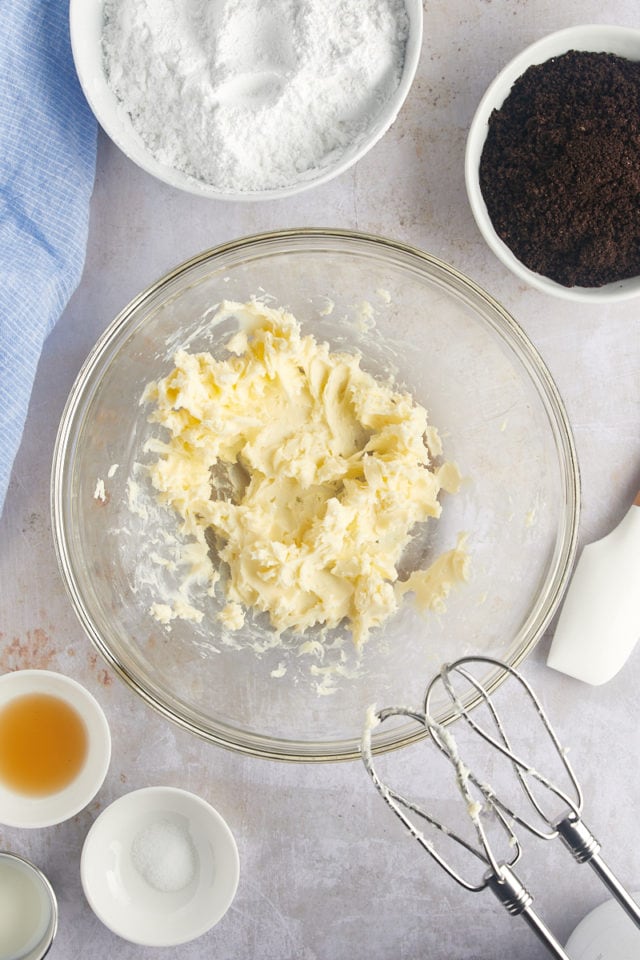 Overhead view of creamed butter in mixing bowl