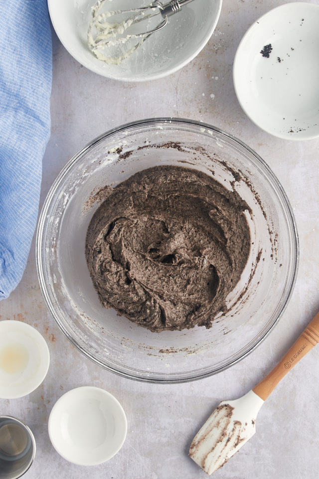Overhead view of Oreo frosting in glass mixing bowl