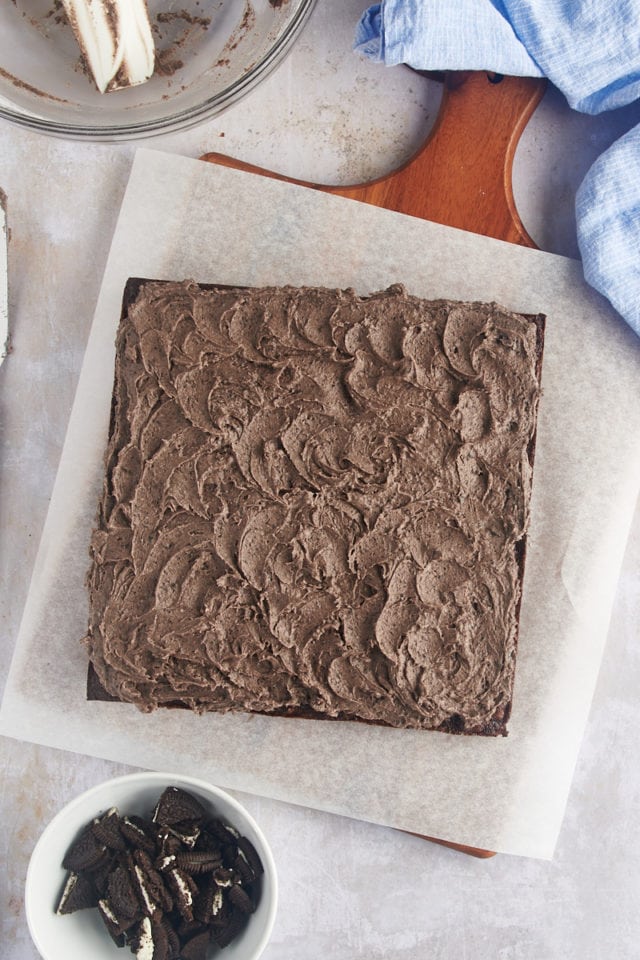 Overhead view of frosted Oreo brownies on parchment paper