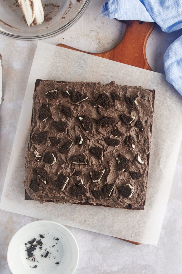 Overhead view of Oreo brownies on parchment before cutting