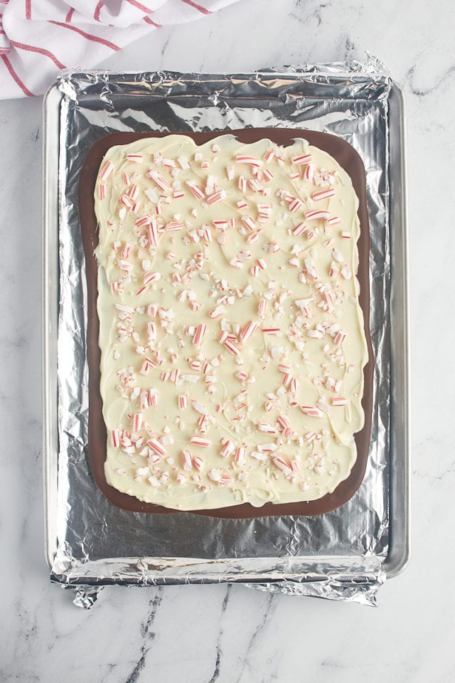 overhead view of finished peppermint bark on a foil-lined baking sheet