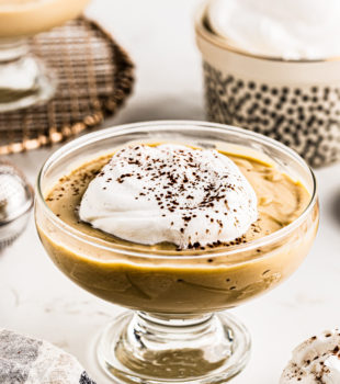 Butterscotch pudding with whipped cream on top