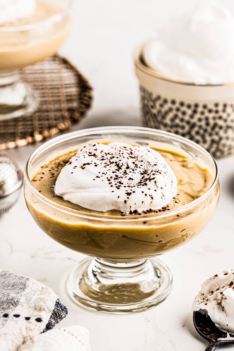 Butterscotch pudding with whipped cream on top