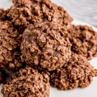Pile of no-bake chocolate oatmeal cookies on plate