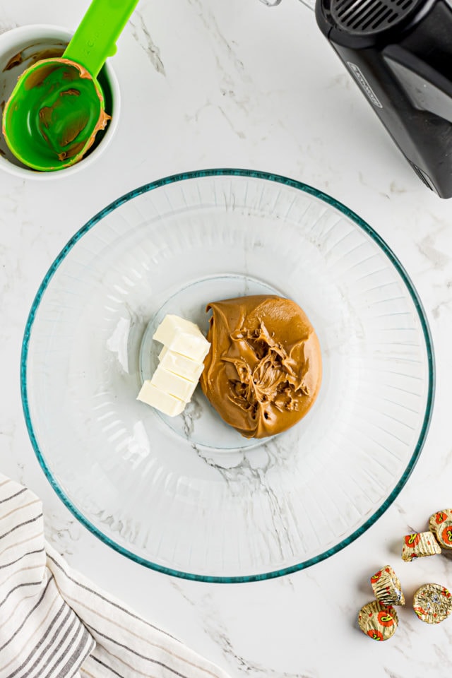 Butter and peanut butter in mixing bowl