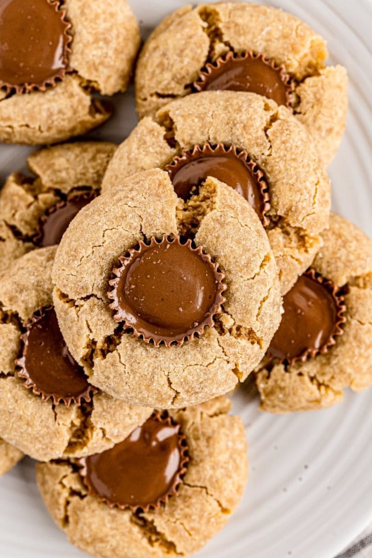 Overhead view of peanut butter cup cookies piled onto plate