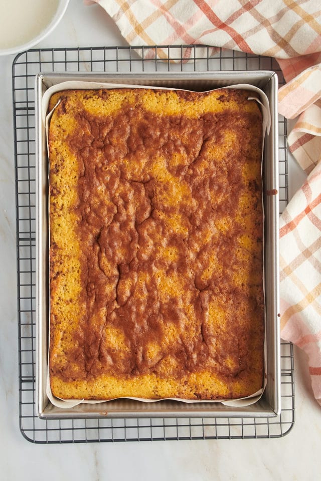 Overhead view of honey bun cake in pan before adding glaze