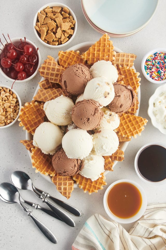 overhead view of scoops of ice cream placed on top of broken waffle cone pieces