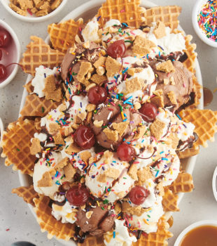 overhead view of ice cream nachos served on an oval white platter