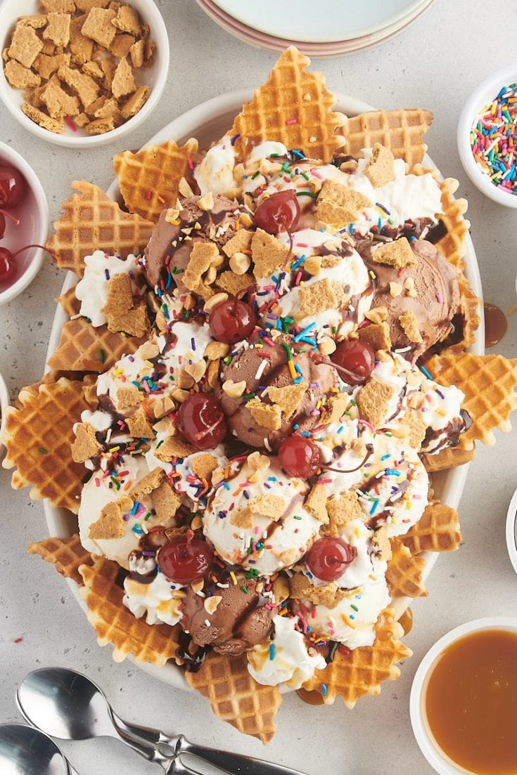 overhead view of ice cream nachos served on an oval white platter