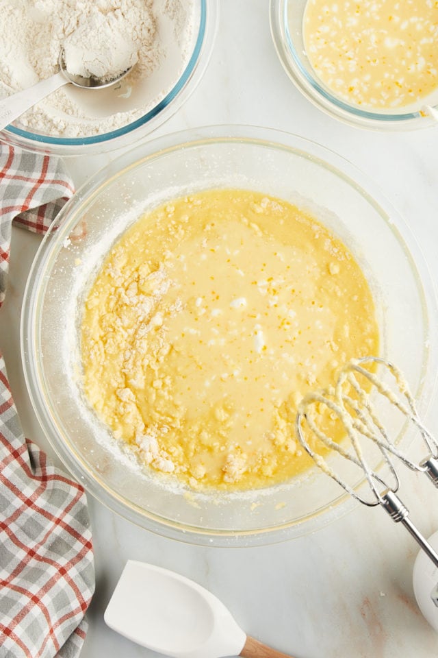 overhead view of orange juice mixture added to pound cake batter