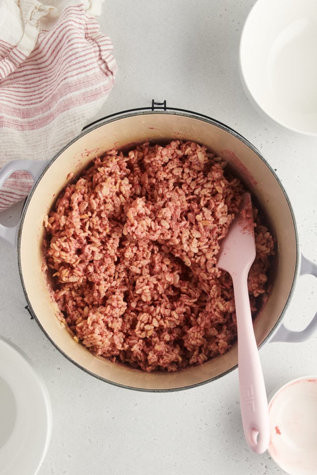 overhead view of strawberry rice crispy treats mixture in a large pot