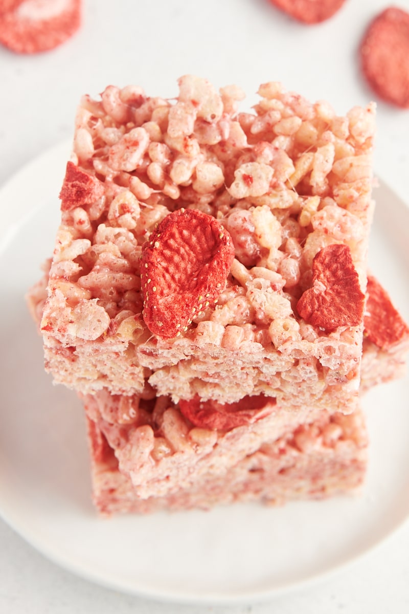 a stack of three strawberry rice crispy treats on a white plate