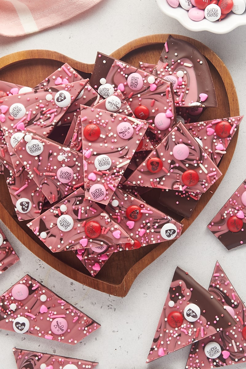 overhead view of marbled Valentine's bark on a heart-shaped wooden tray with more bark surrounding