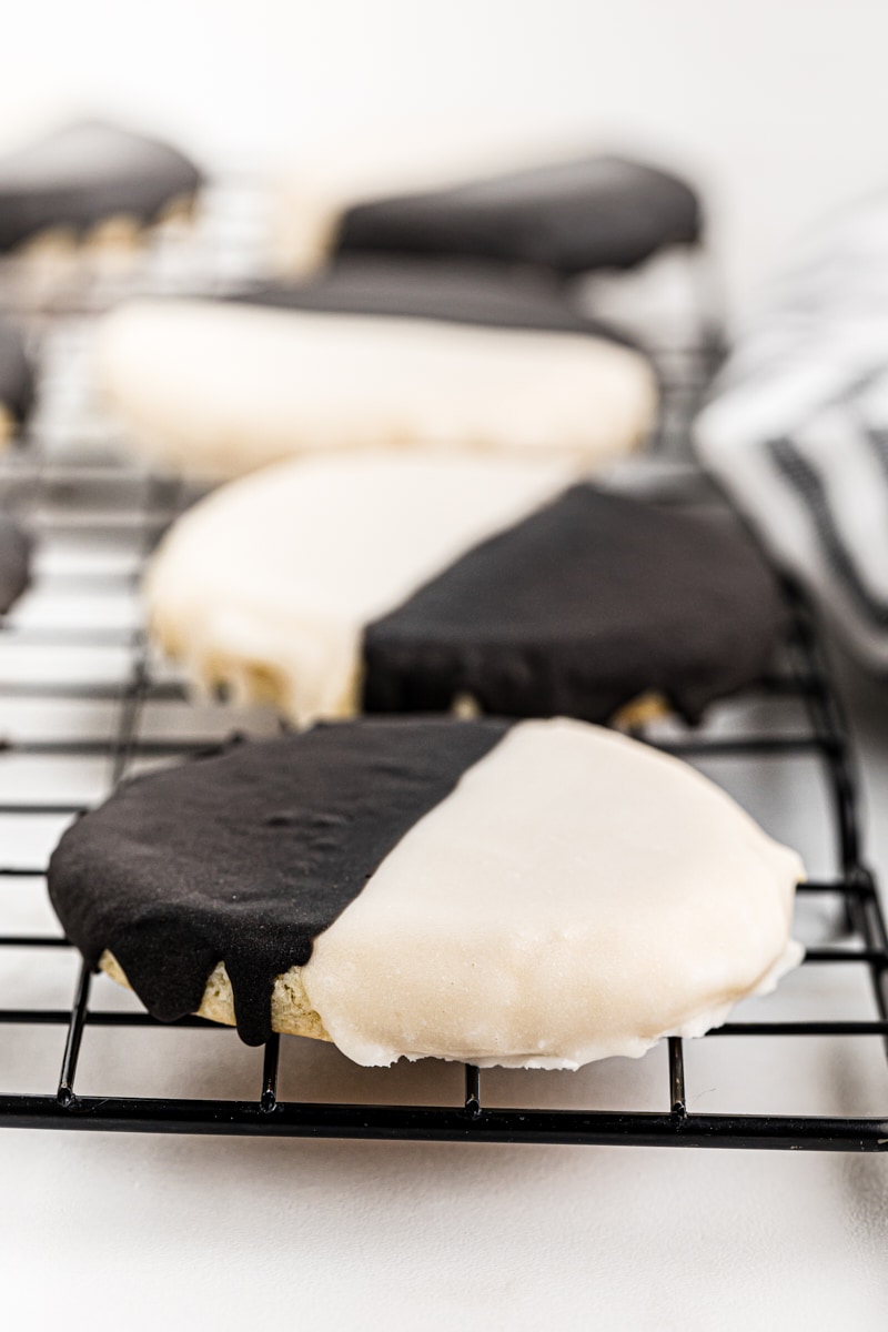 black and white cookies on a wire cooling rack