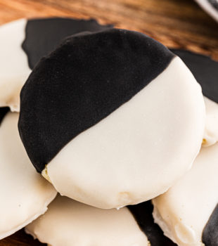 black and white cookies on a wooden tray
