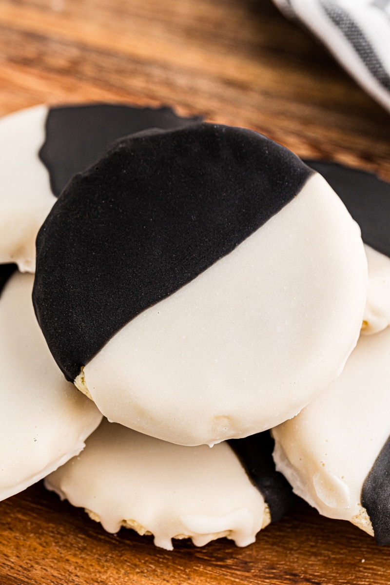 black and white cookies on a wooden tray