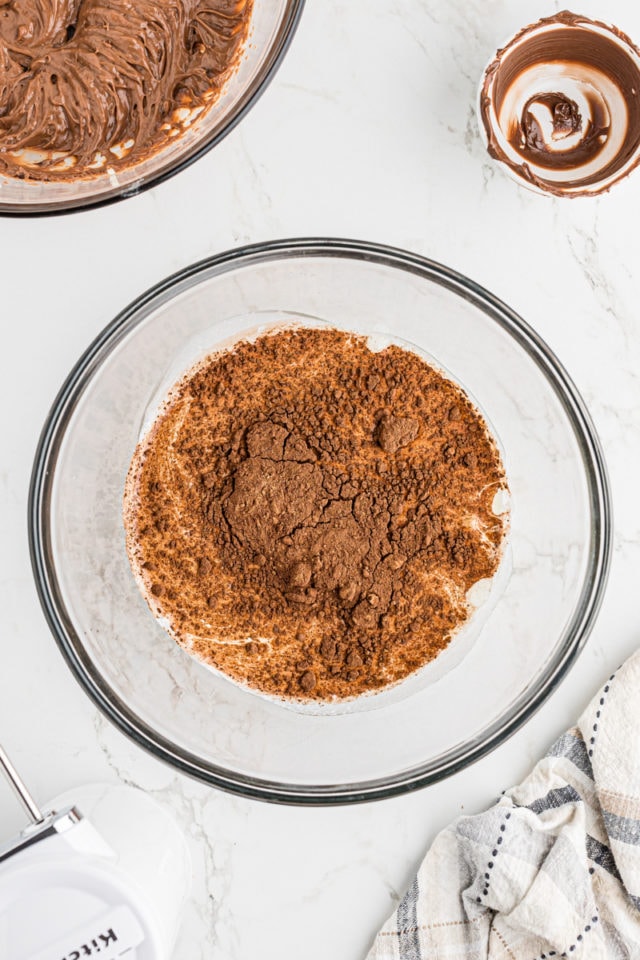 Overhead view of cocoa powder added to liquid ingredients