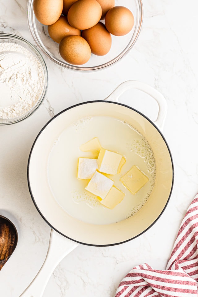 overhead view of milk, water, sugar, butter, and salt in a saucepan