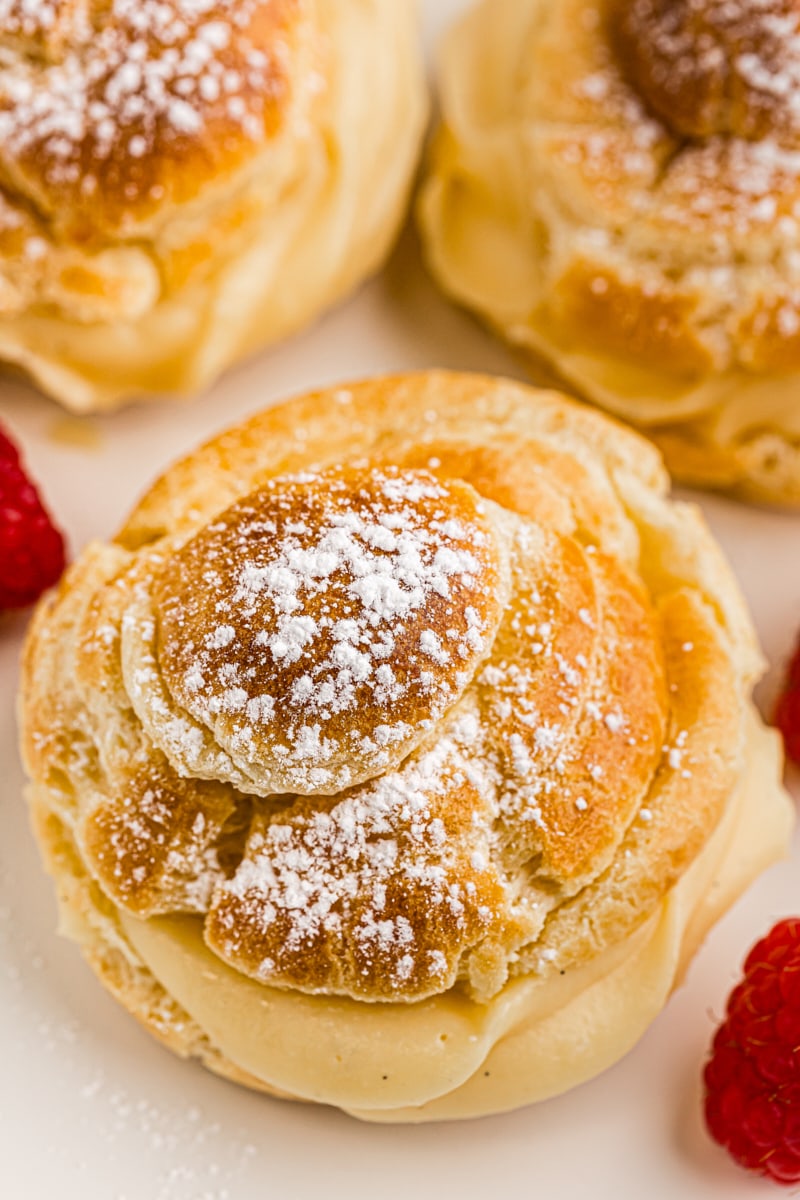 close-up view of a cream puff on a white plate