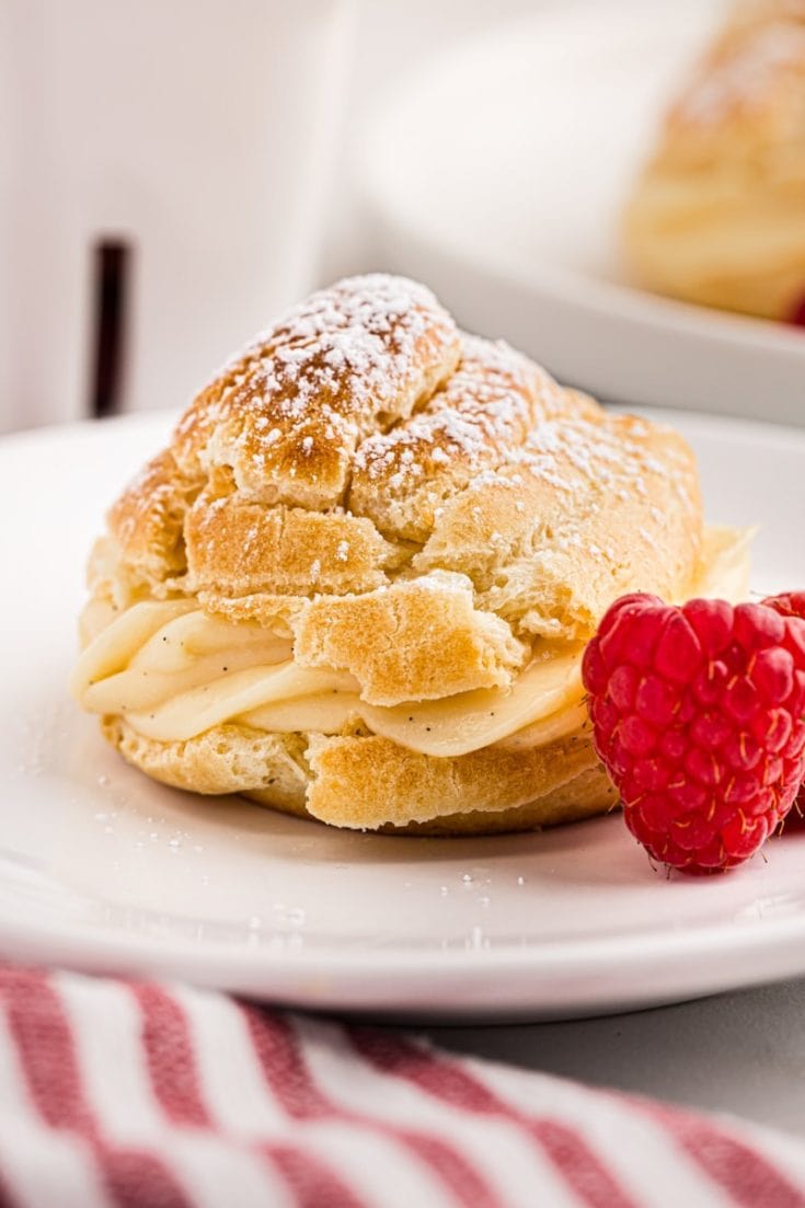 a cream puff served on a white plate