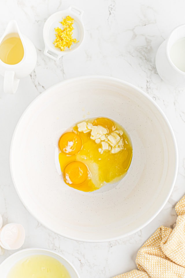 overhead view of egg yolks and butter in a mixing bowl