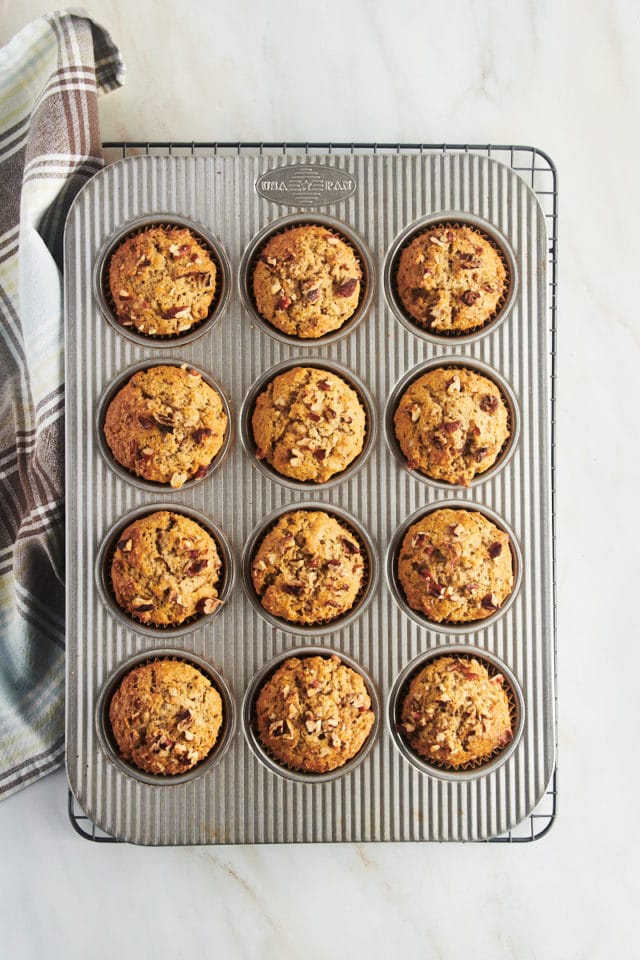Overhead view of cinnamon pecan muffins in muffin pan