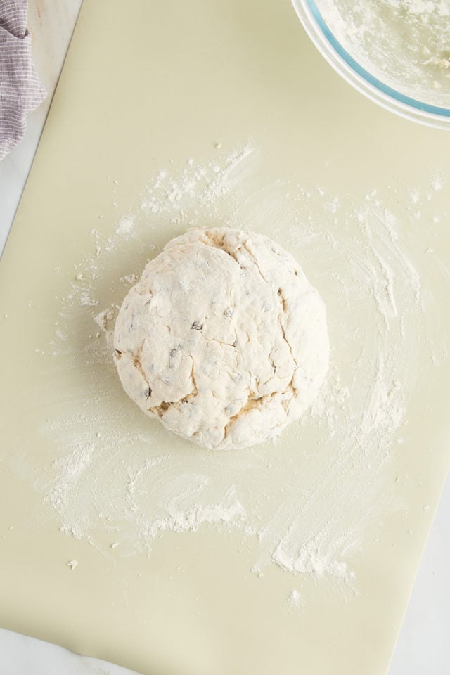 overhead view of Irish soda bread dough shaped into a round loaf