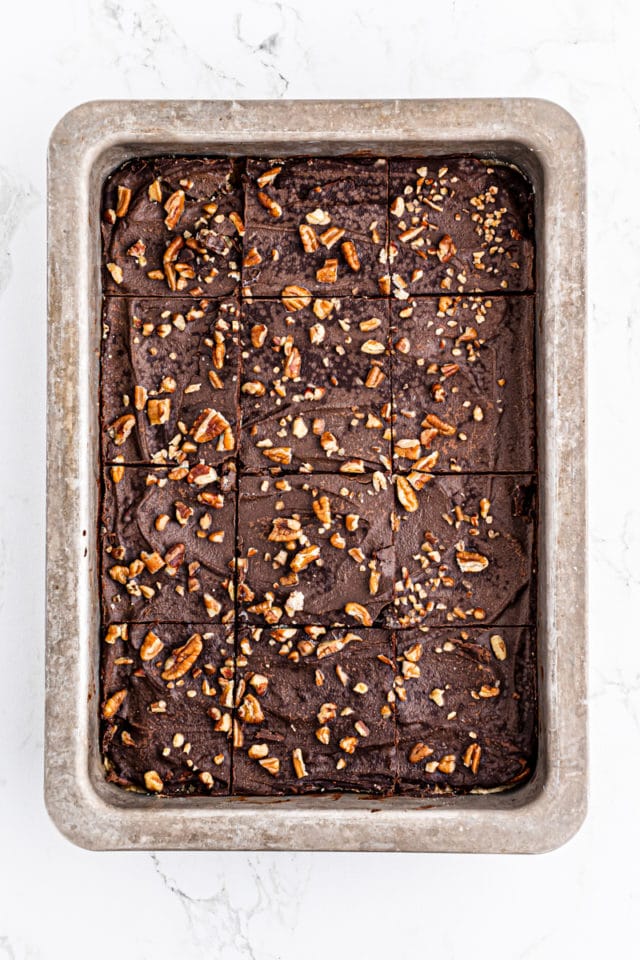 overhead view of sliced butter pecan turtle bars in a rectangular baking pan