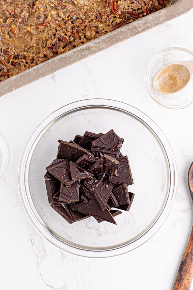 overhead view of chocolate in a glass mixing bowl