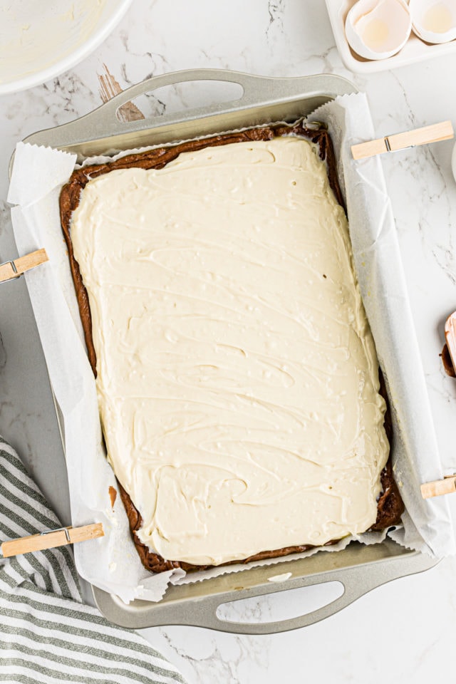 Overhead view of cream cheese layer for Irish cream brownies