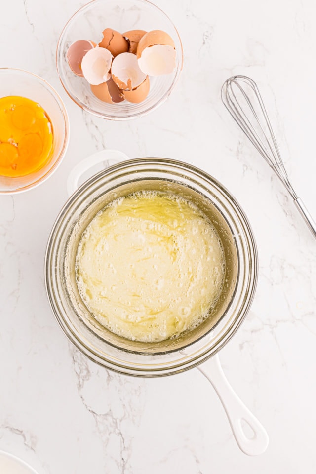 overhead view of egg whites and sugar in a double boiler